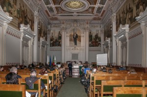 Delegates sit in beautiful ornate hall